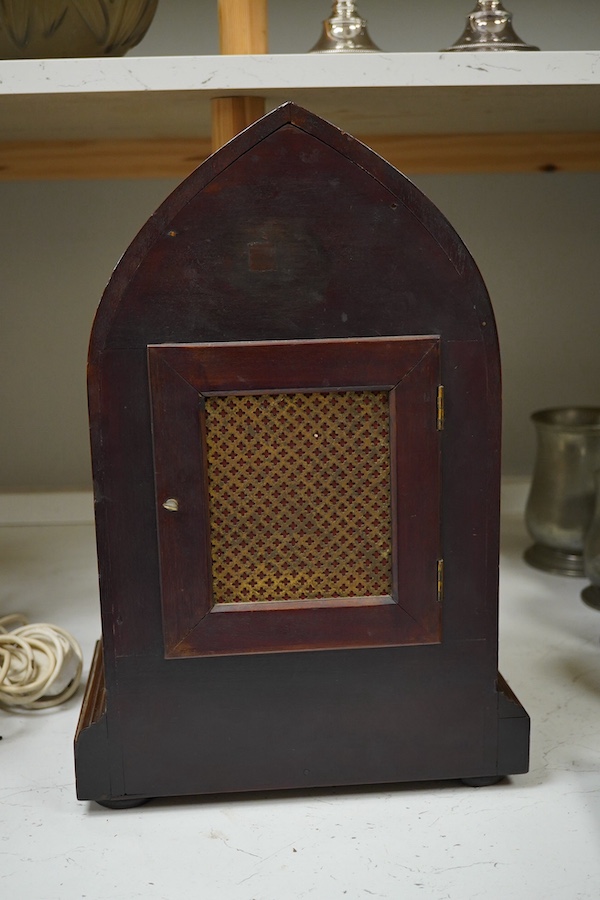 An Edwardian three train mahogany bracket clock and bracket, chiming on four coiled gongs, clock 42.5cm high. Condition - good